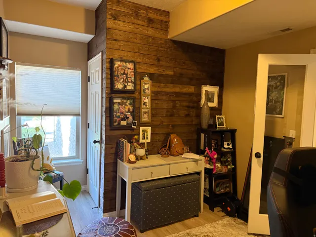 Interior space with wood walls and light wood-style flooring