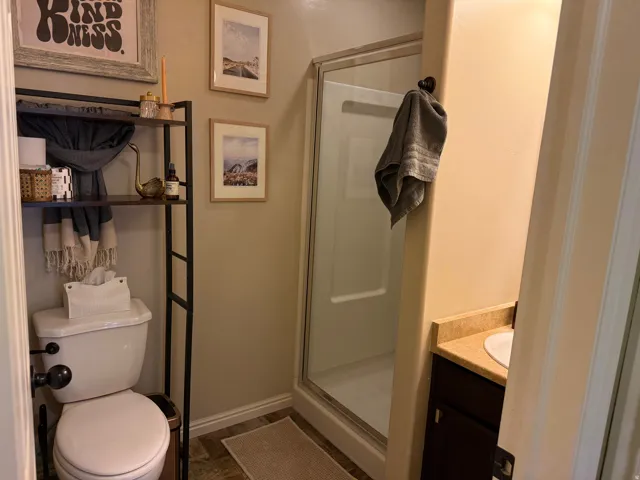 Bathroom with a stall shower and vanity