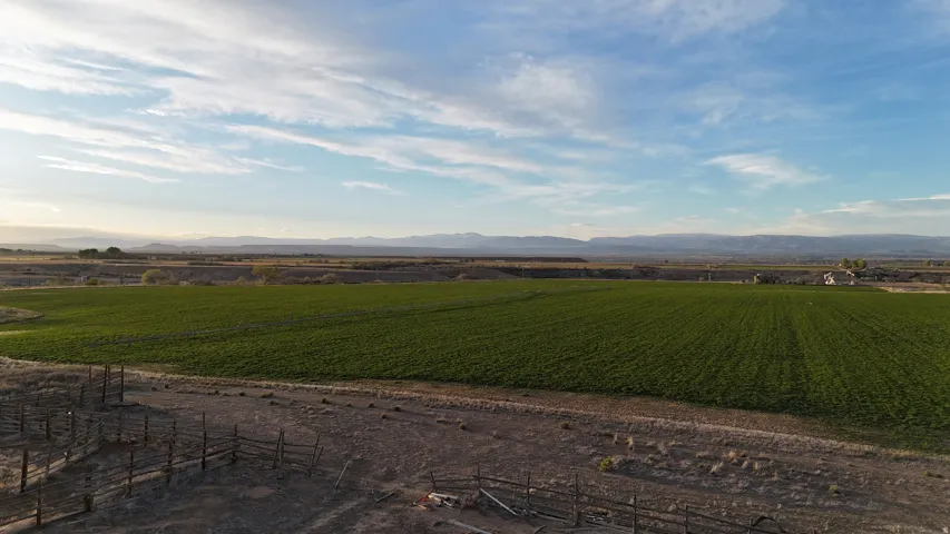 View of mountain background featuring farmland and rural landscape