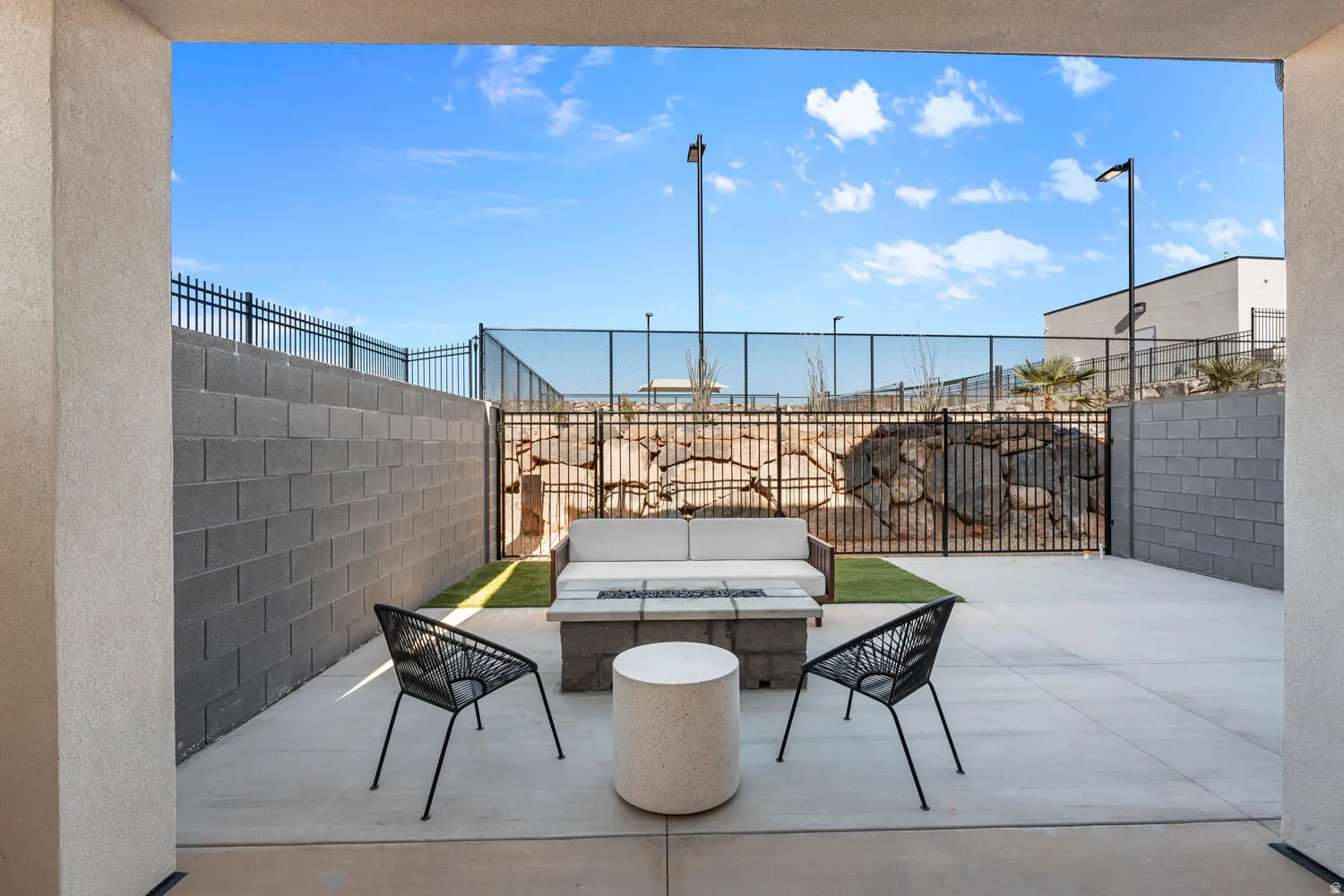 Fenced backyard with a patio area and an outdoor hangout area