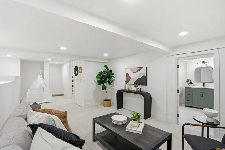 Living room featuring light carpet and recessed lighting