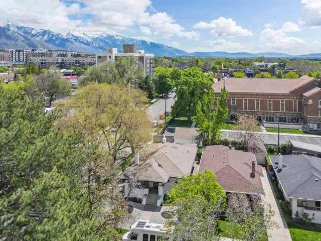 Aerial view of a mountain backdrop and apartment complex / building