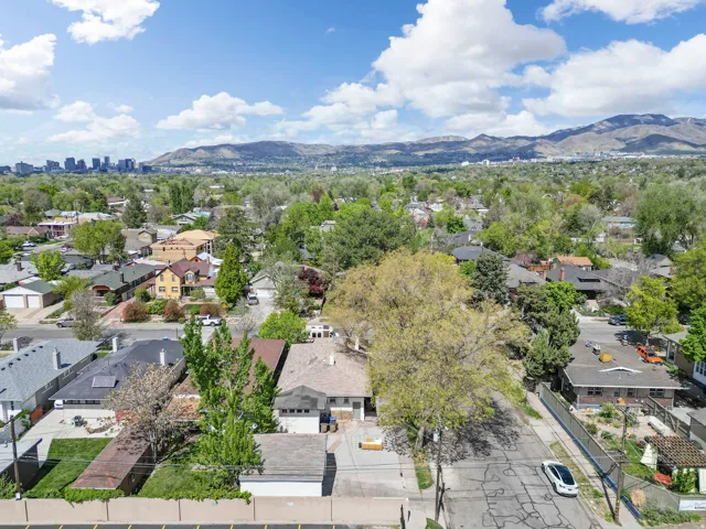 Aerial perspective of suburban area with a mountain backdrop