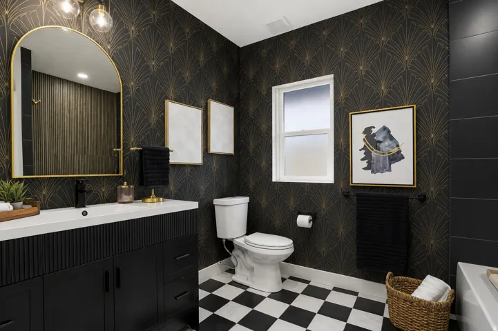 Bathroom featuring black and white checkerboard flooring