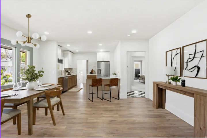 Dining space featuring light wood-style flooring and suspended lighting