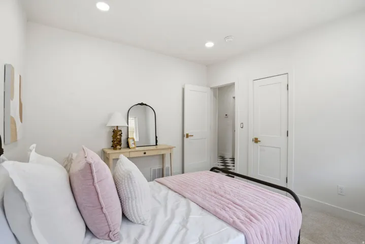 Carpeted bedroom featuring recessed lighting and baseboards