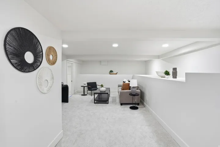 Sitting room featuring light colored carpet and recessed lighting