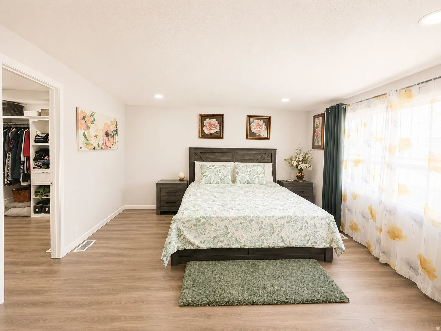 Bedroom featuring wood-finish flooring, recessed lighting, and a window with sheer and blackout curtains