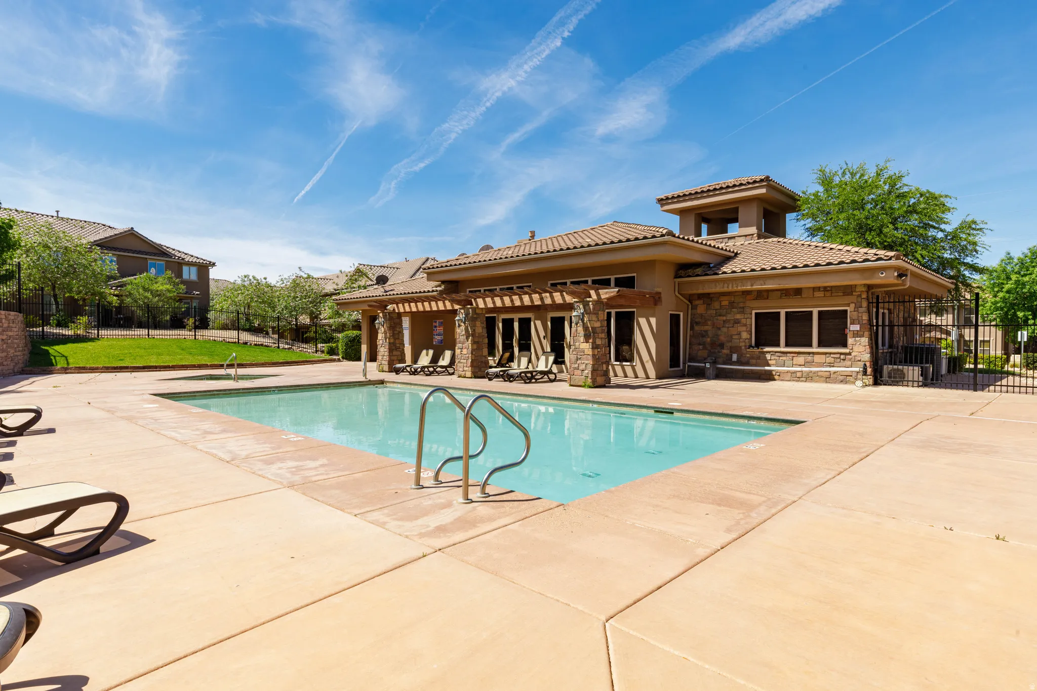 Community pool with a patio area