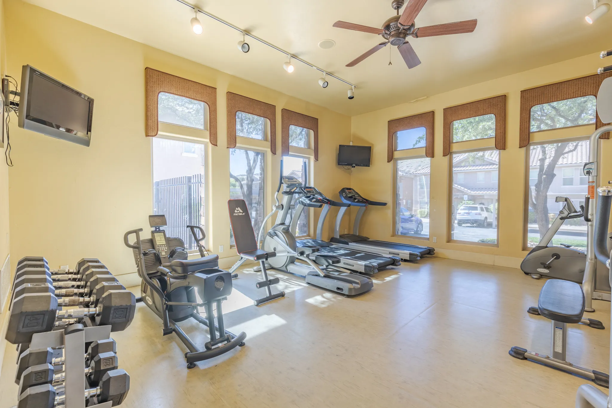 Exercise room with free weights and cardio machines