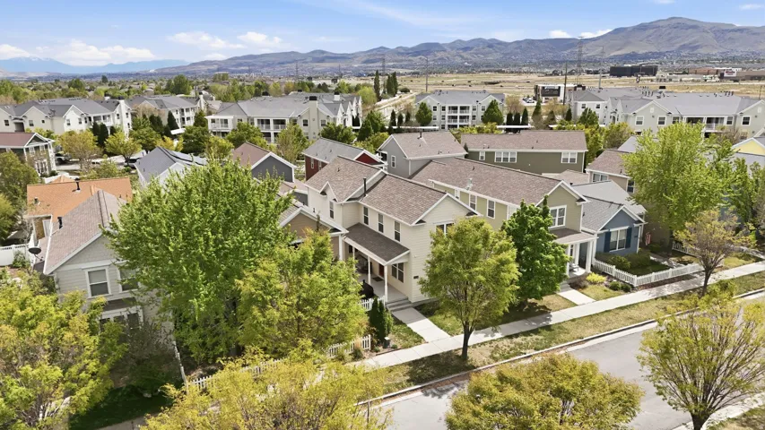 Aerial perspective of suburban area featuring a mountainous background