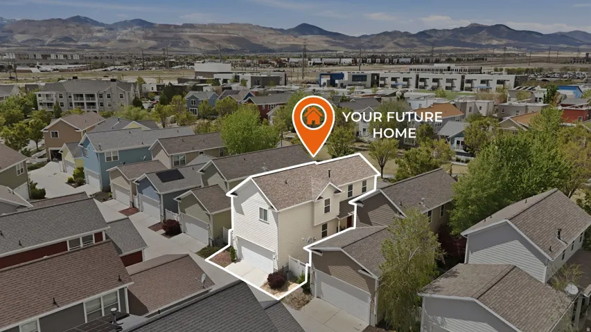 Aerial perspective of suburban area with a mountainous background