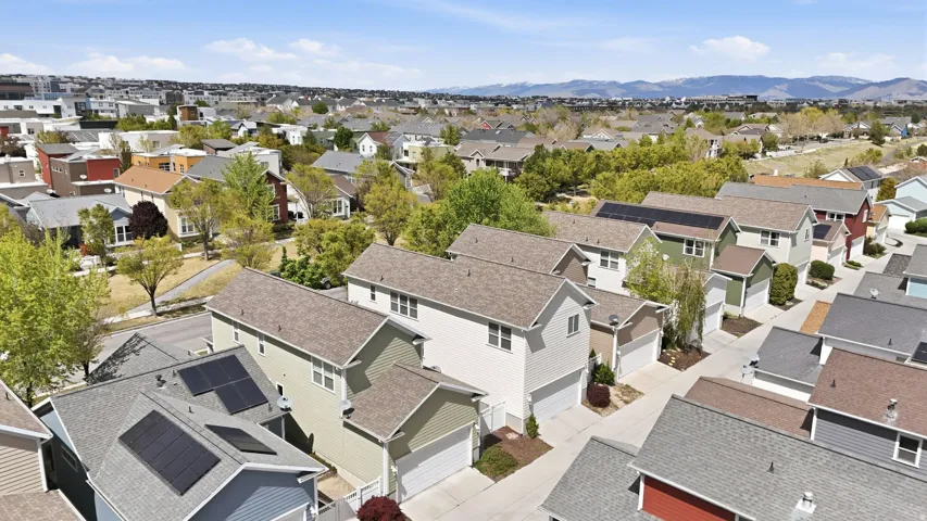 Aerial perspective of suburban area with a mountainous background