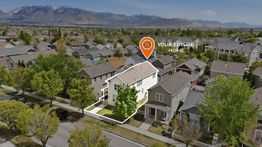 Aerial perspective of suburban area featuring mountains and property parcel outlined