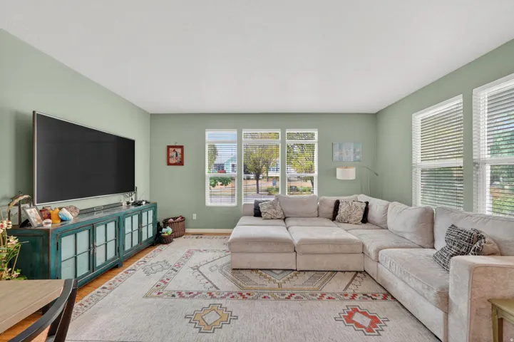 Living room featuring baseboards and wood finished floors