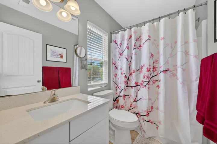 Full bath featuring vanity and a shower with shower curtain