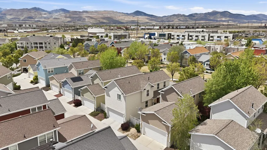 Aerial perspective of suburban area featuring a mountainous background