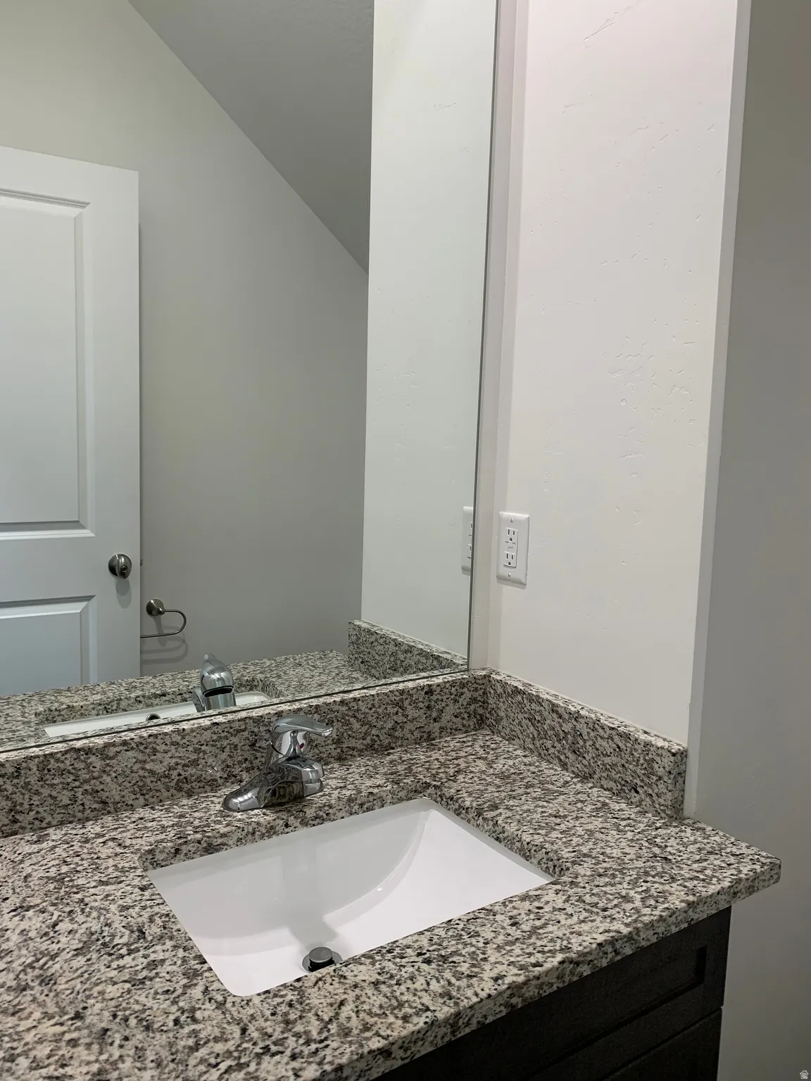 half Bathroom with vanity and recess light