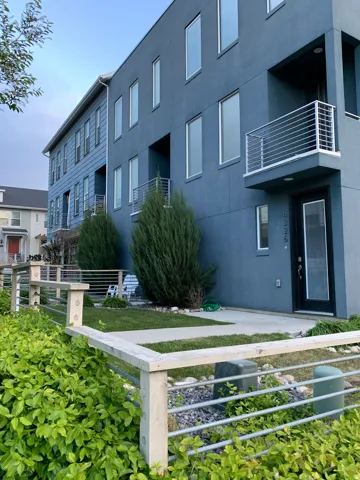 View of apartment building / complex featuring a fenced front yard
