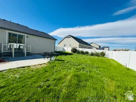 Fenced backyard with a patio