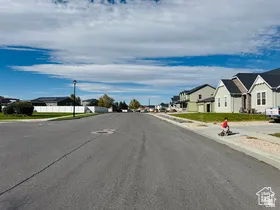 North View of street with a residential view, sidewalks, and curbs