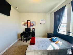 Bedroom TWO featuring carpet flooring and an office area