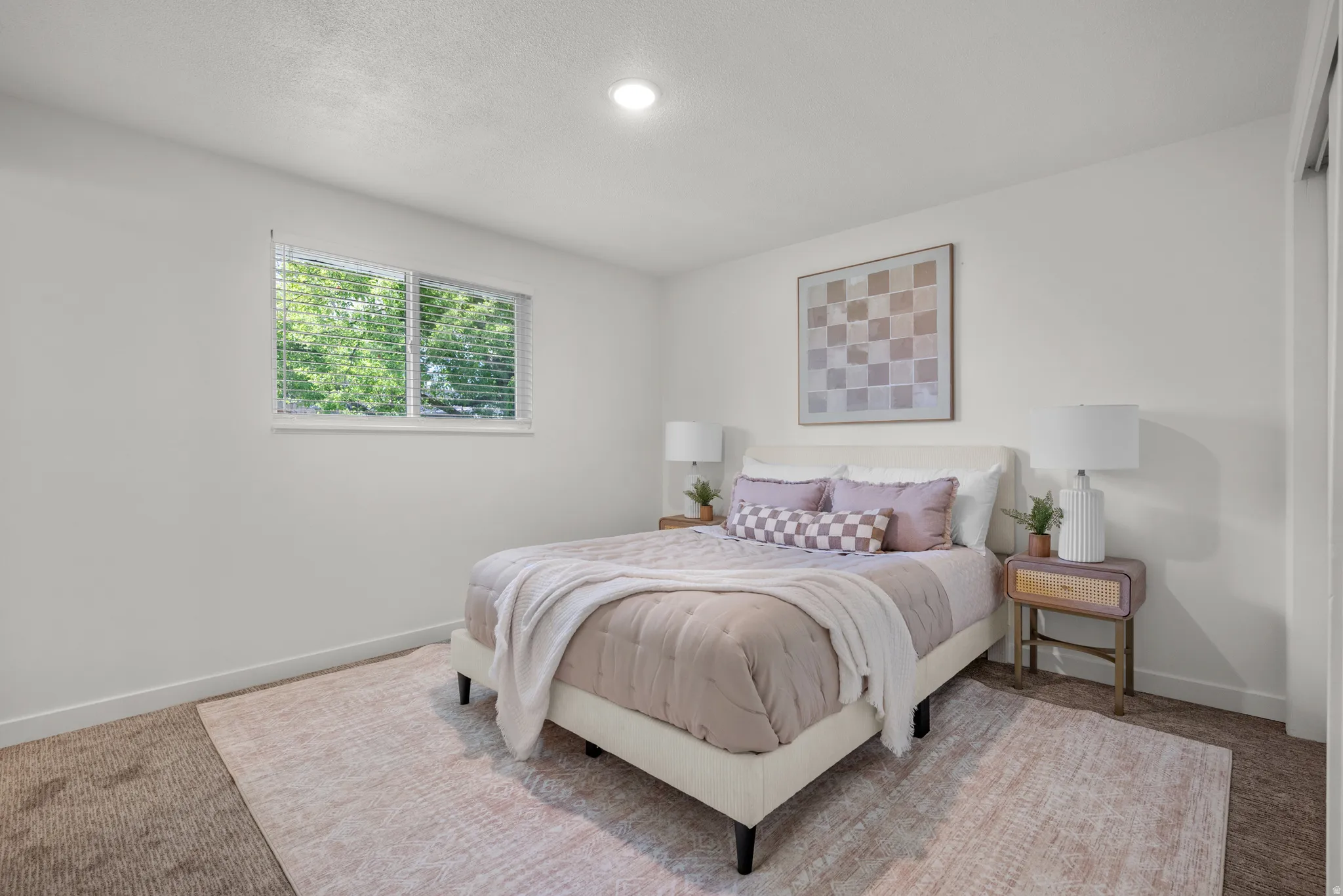 Bedroom with baseboards and carpet