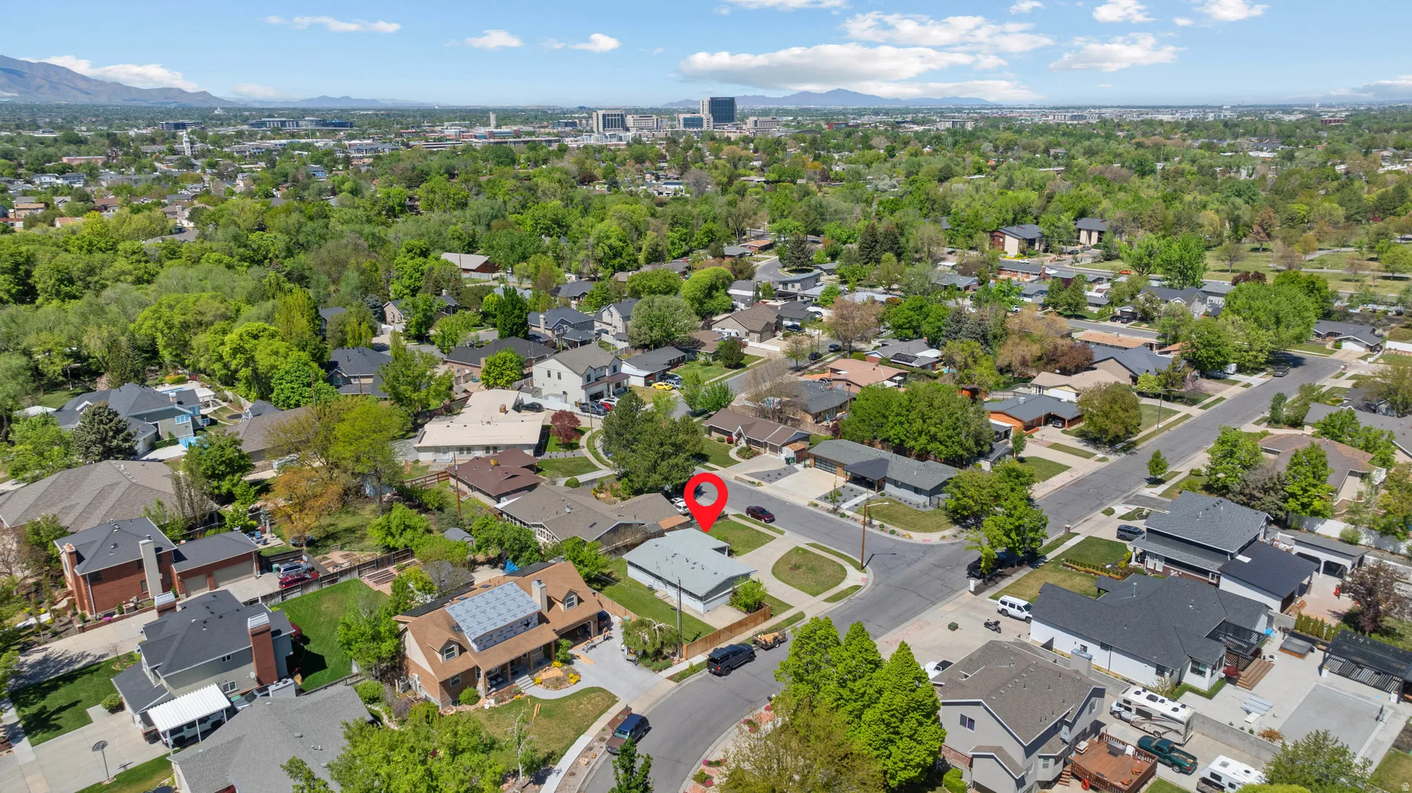 View of property location featuring a mountain backdrop and nearby suburban area