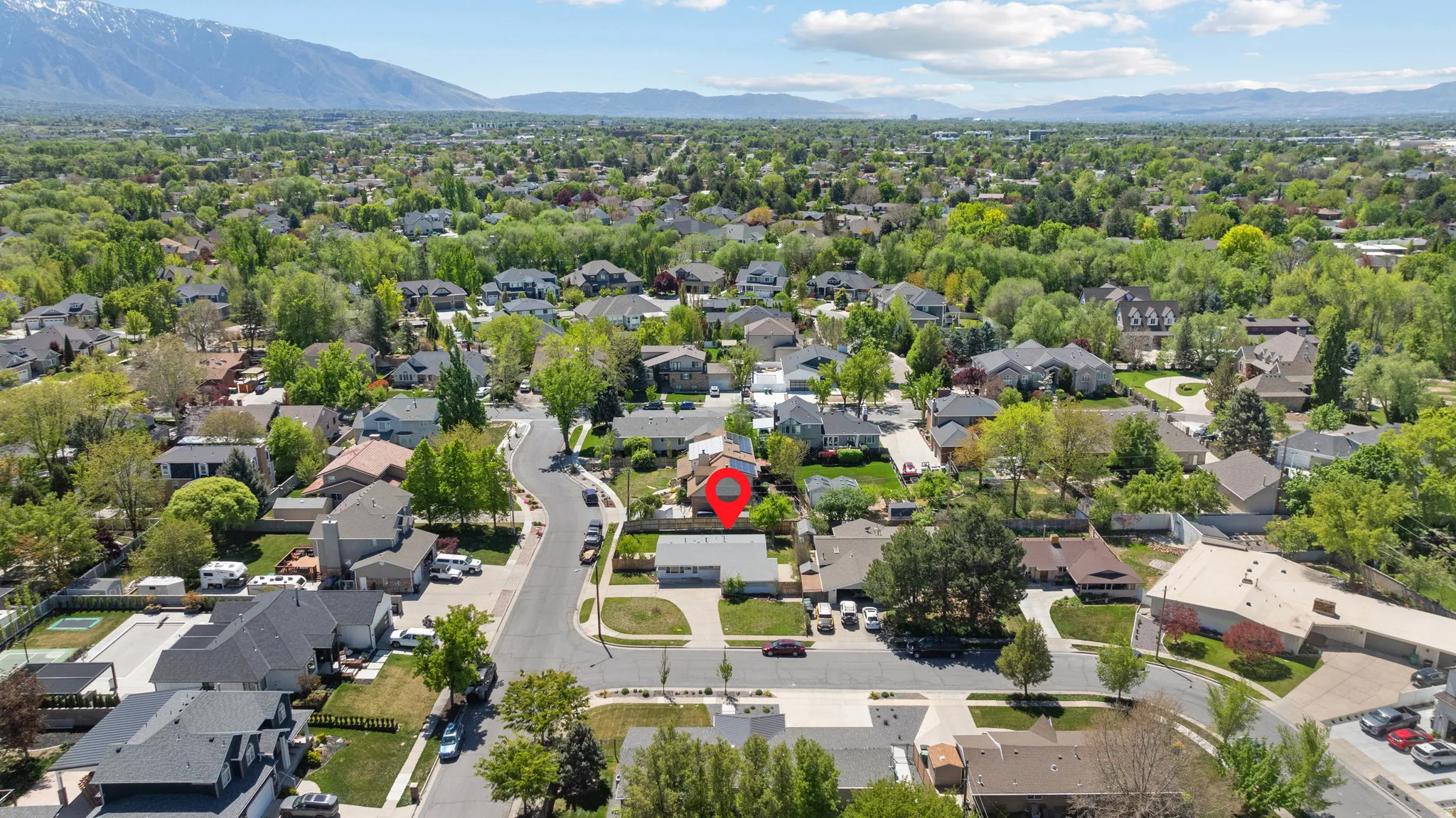 Aerial view of residential area featuring a mountain backdrop