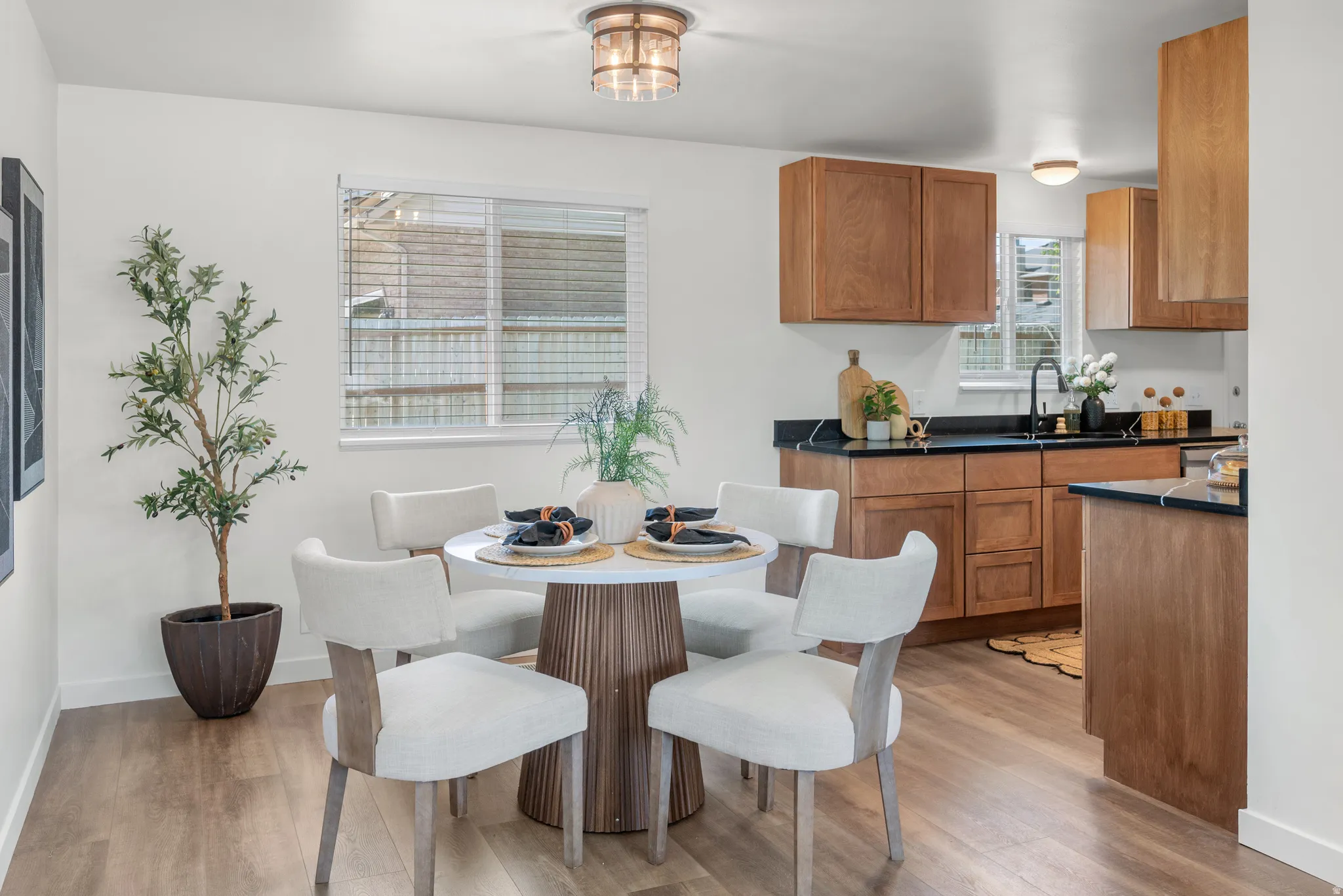 Dining space with light wood finished floors and baseboards