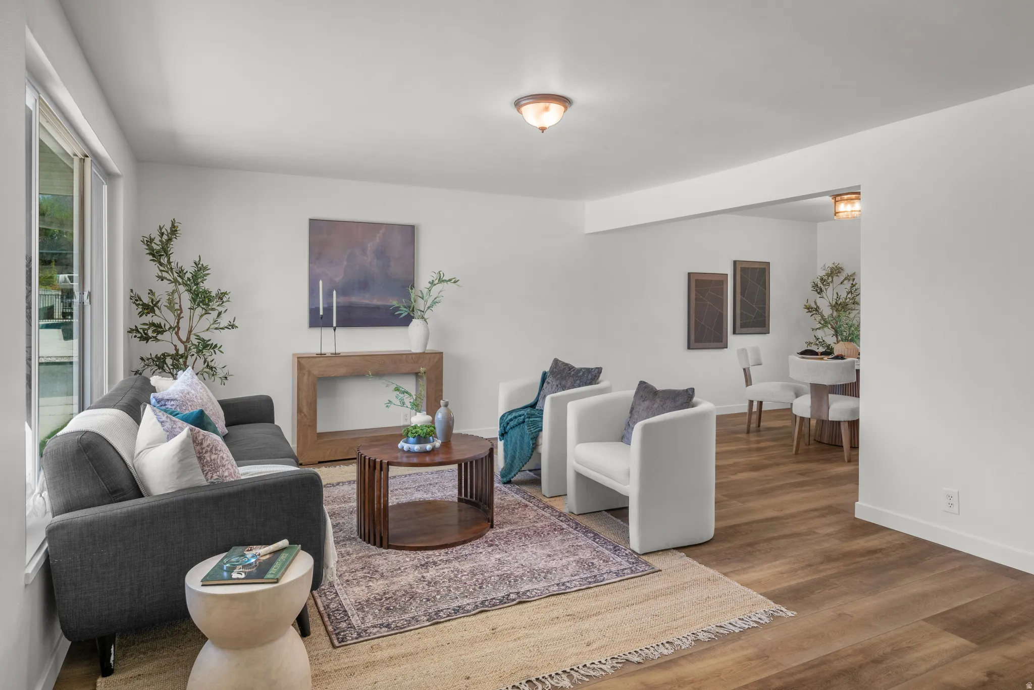 Living area with wood finished floors and baseboards