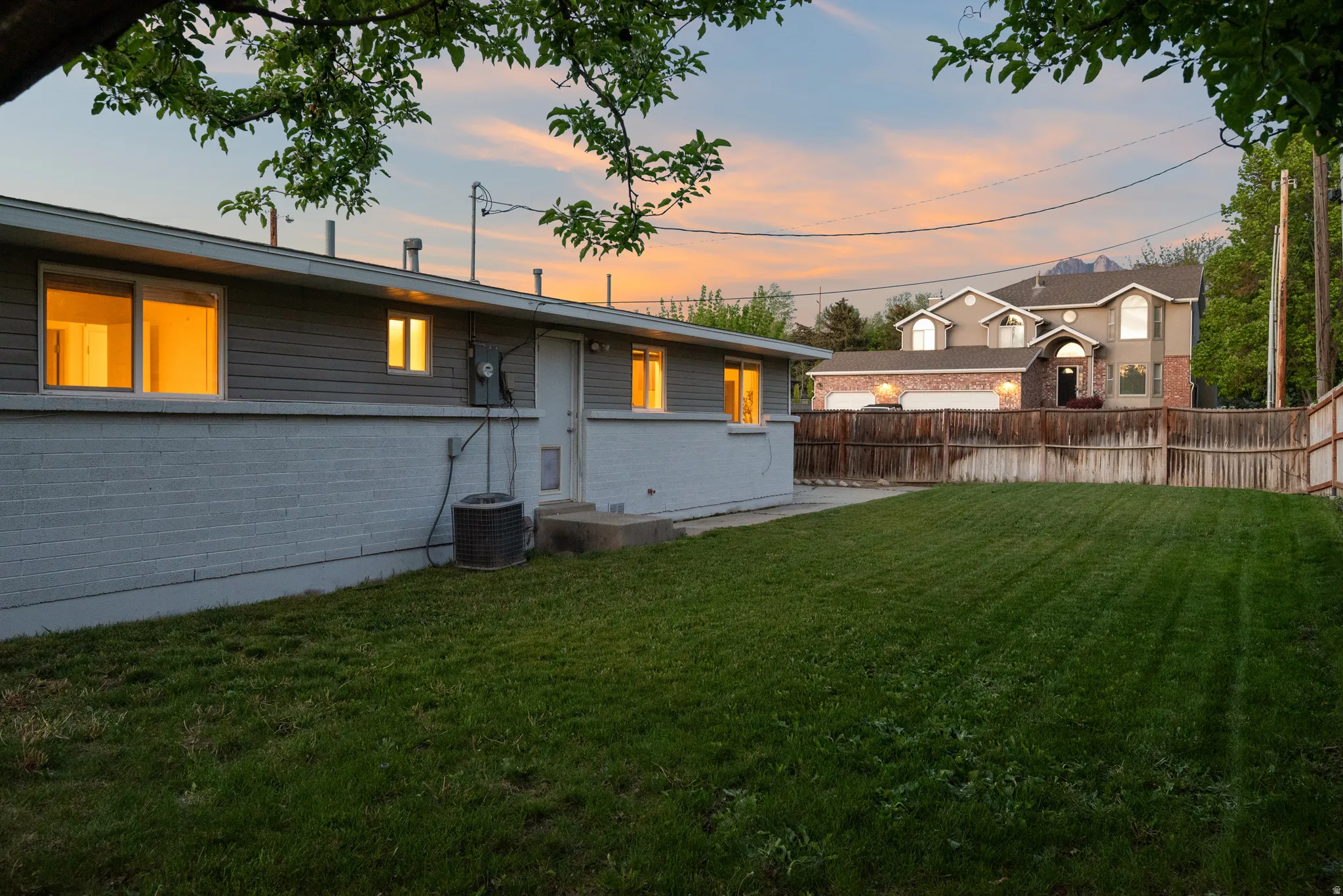 Back of house featuring brick siding