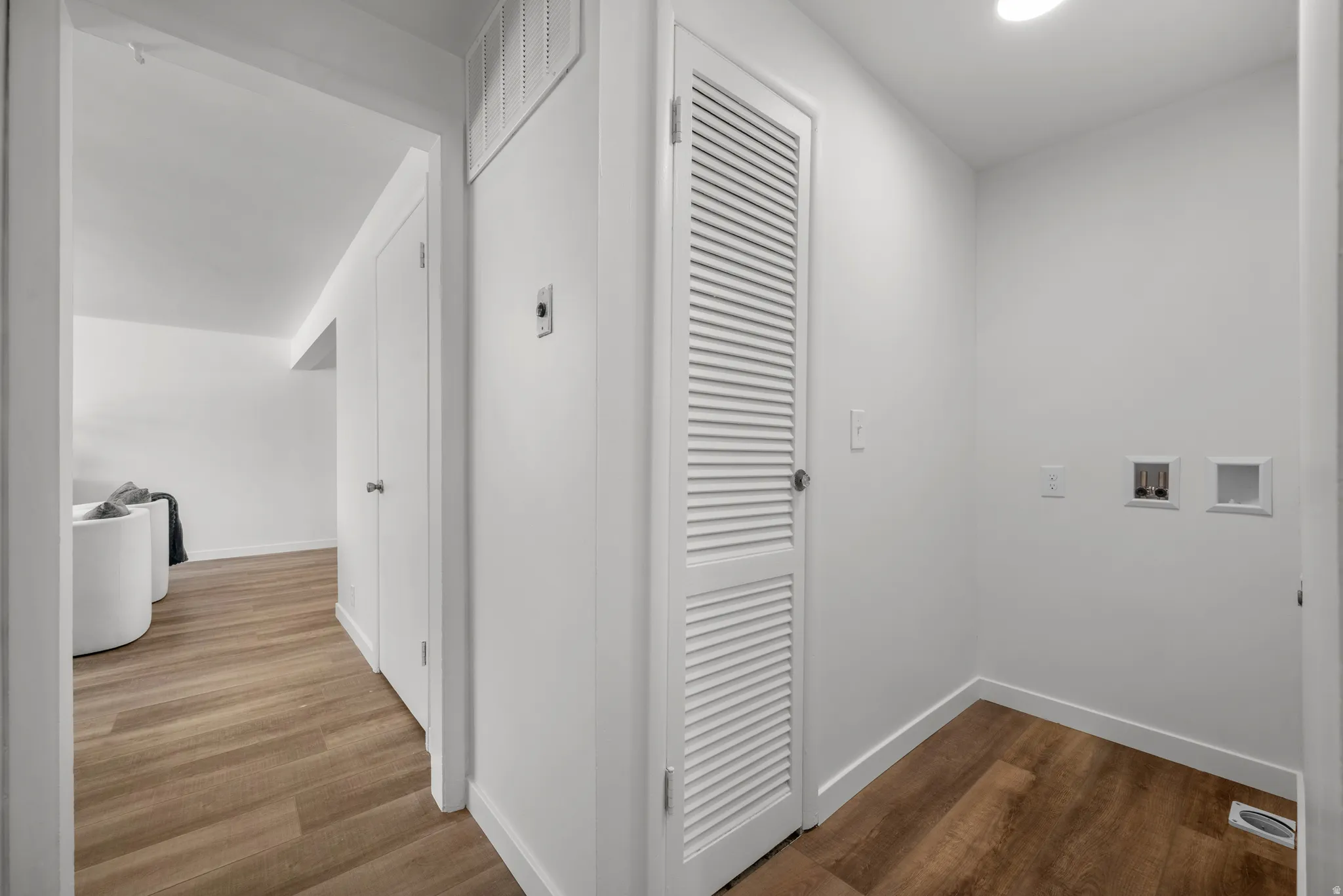 Hall featuring dark wood-style flooring