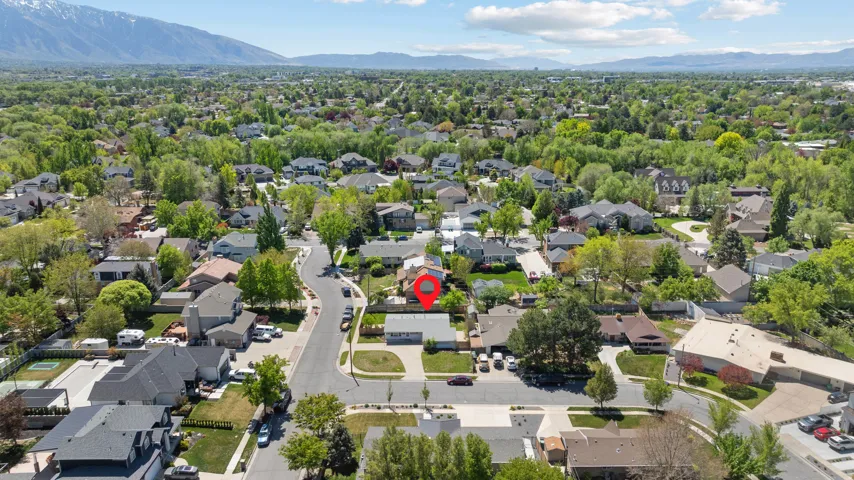 Aerial view of residential area featuring a mountain backdrop