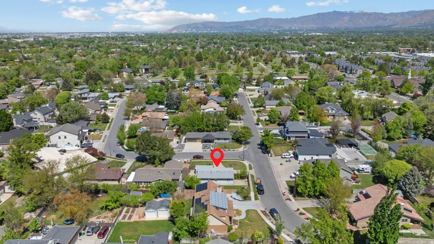 Aerial view of residential area featuring a mountain backdrop