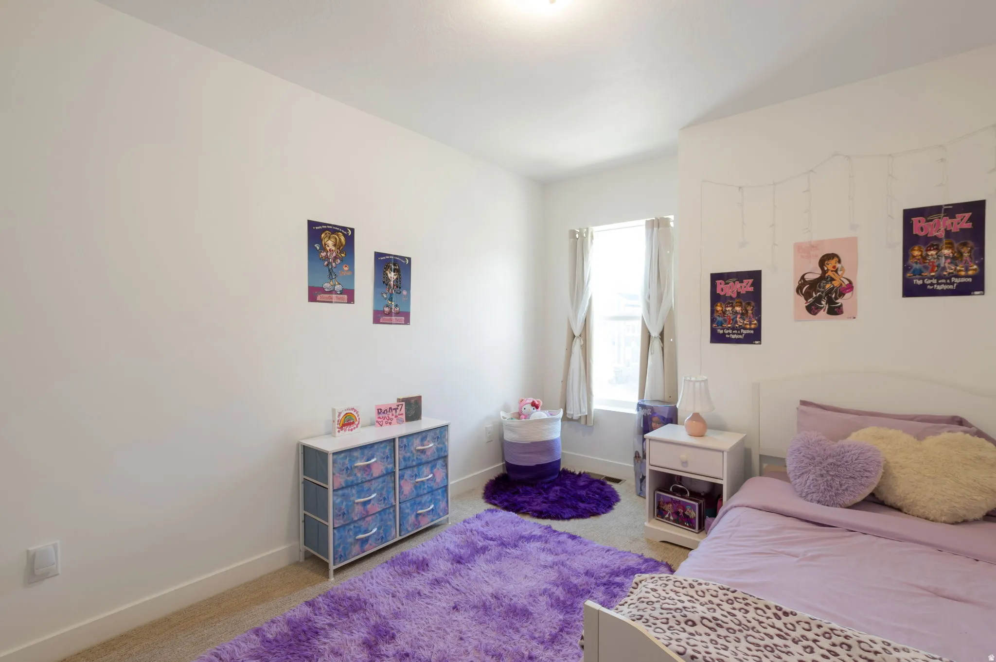 Bedroom featuring carpet and baseboards