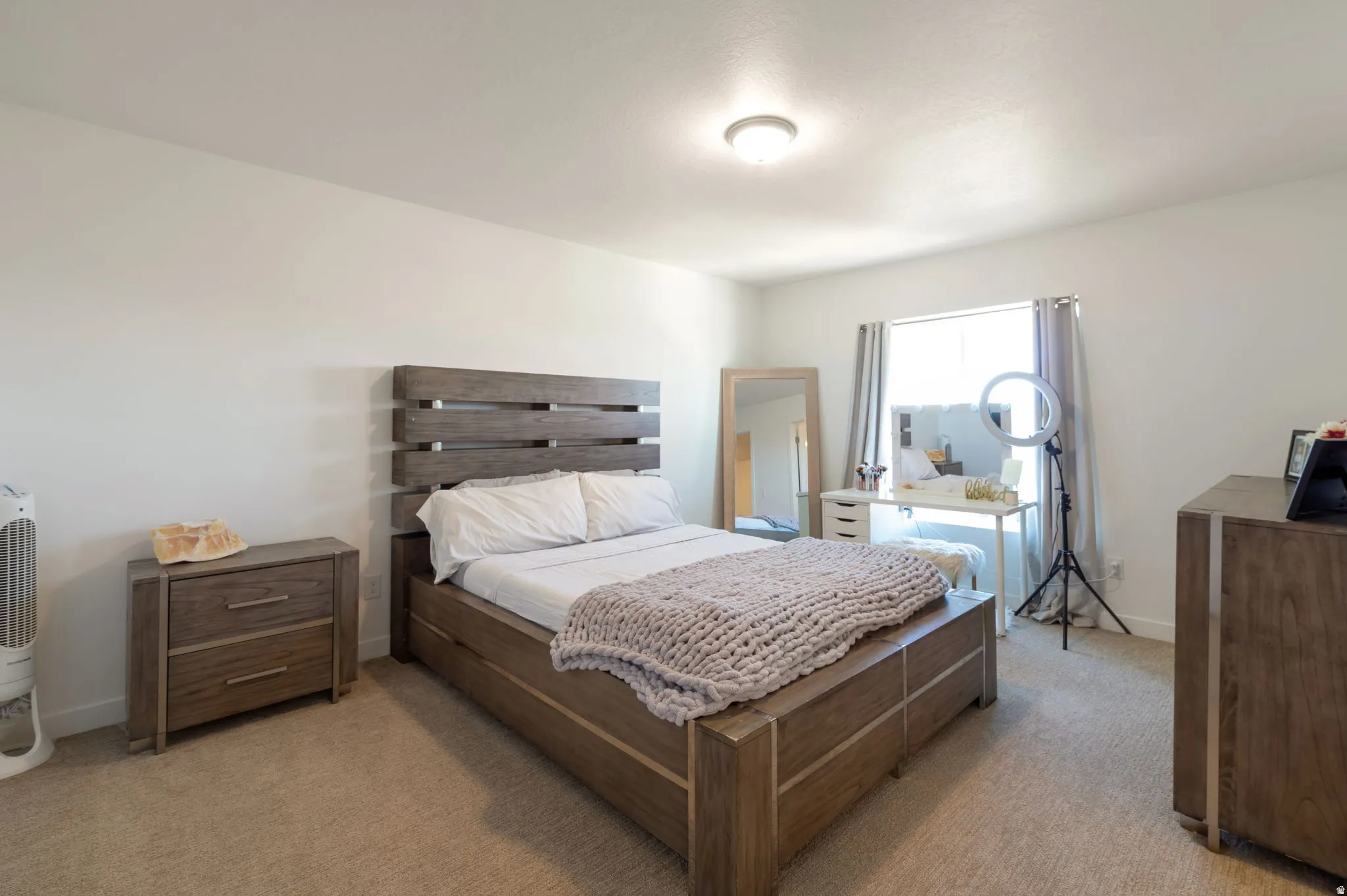 Bedroom with light carpet