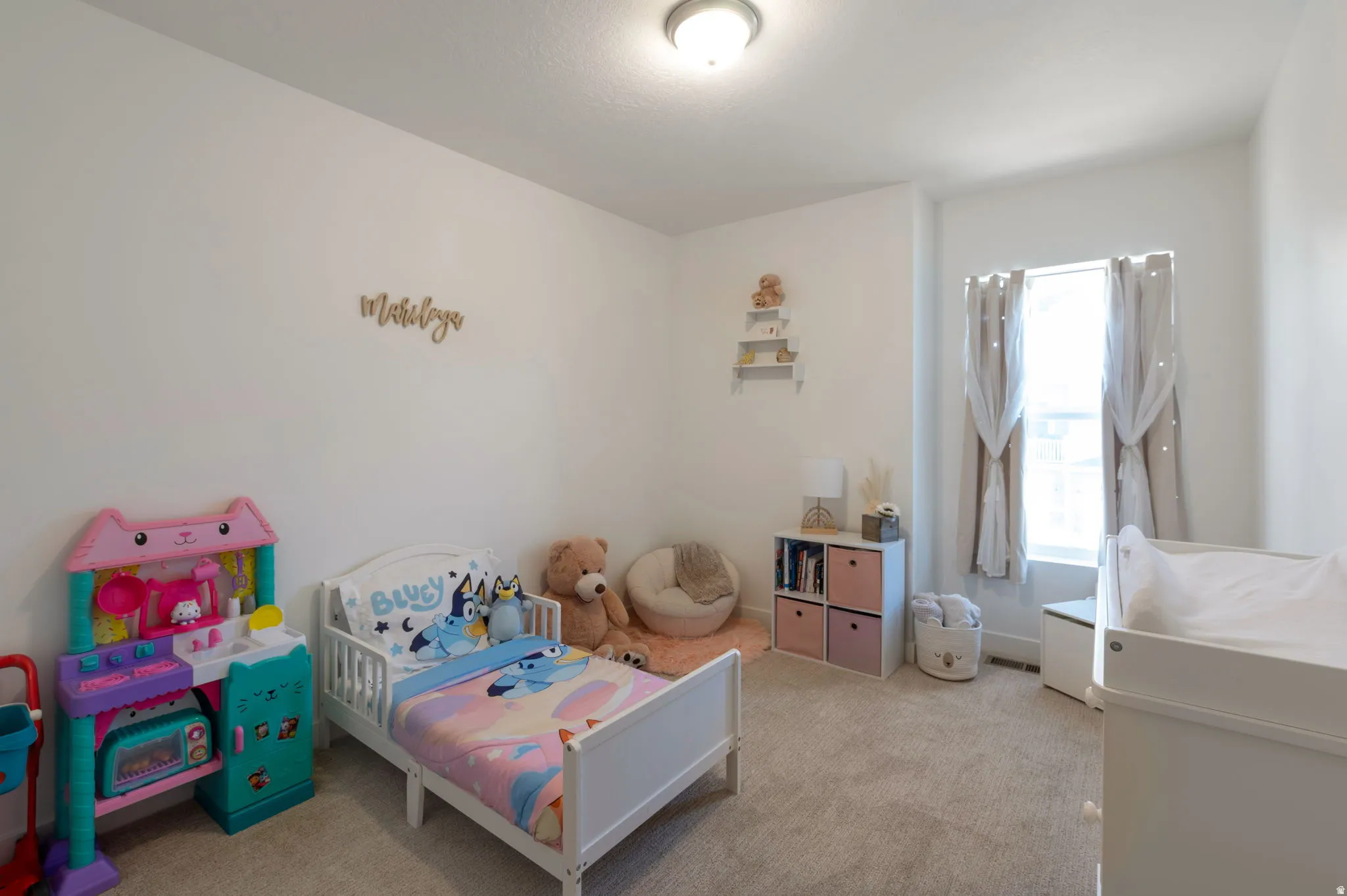 Bedroom with light carpet