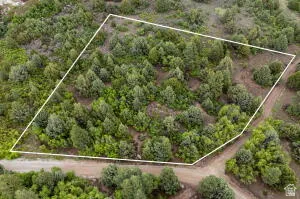 Aerial overview of property's location with property parcel outlined
