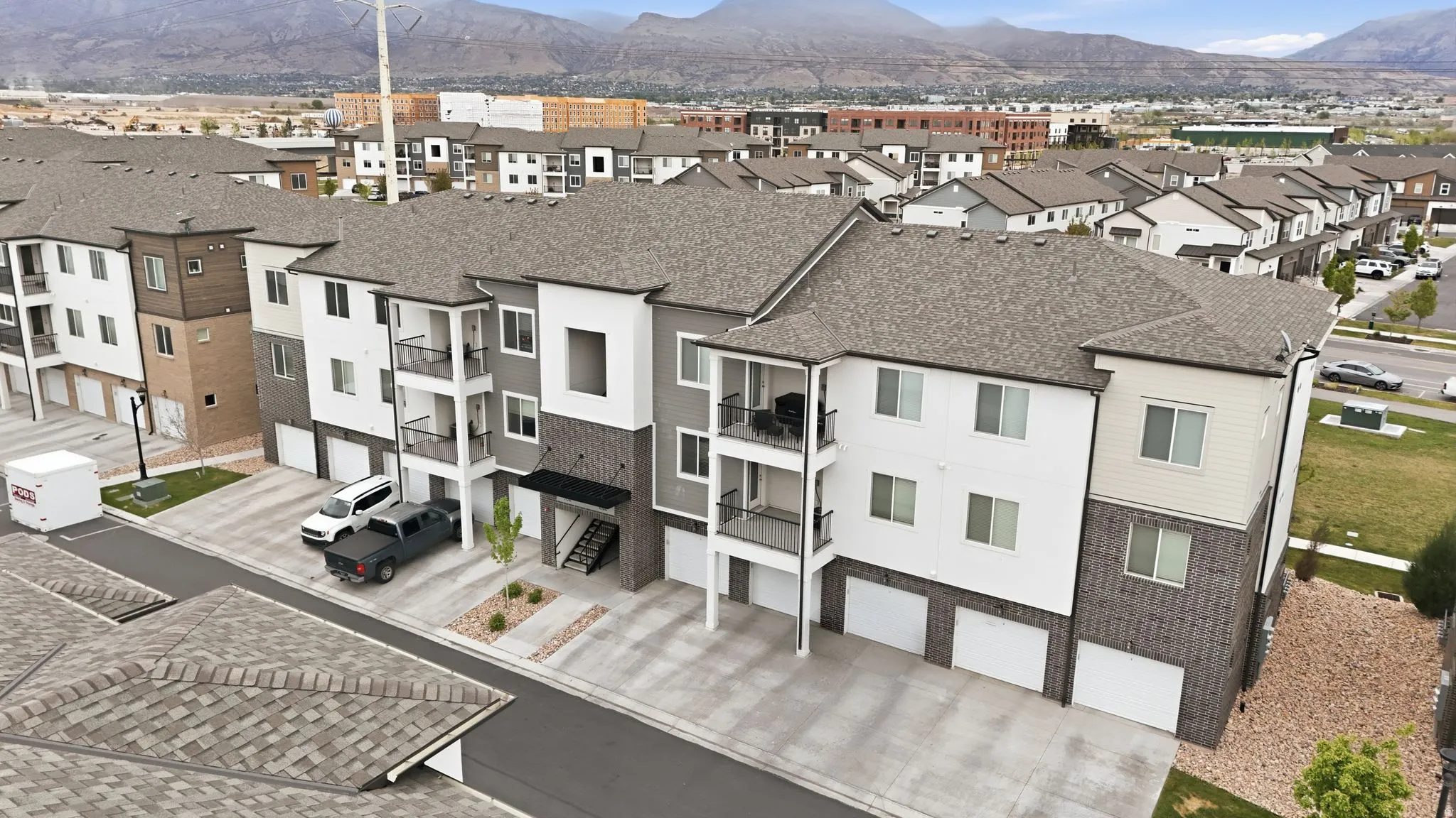 Aerial perspective of suburban area with a mountain backdrop