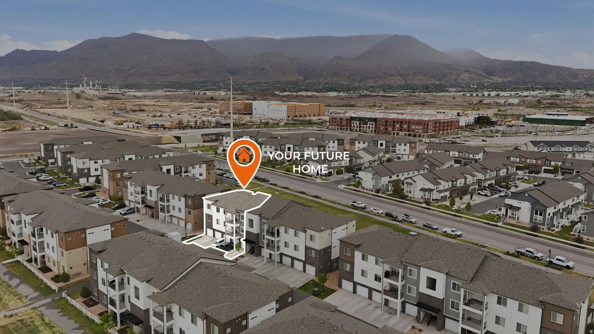 Aerial view of residential area featuring mountains