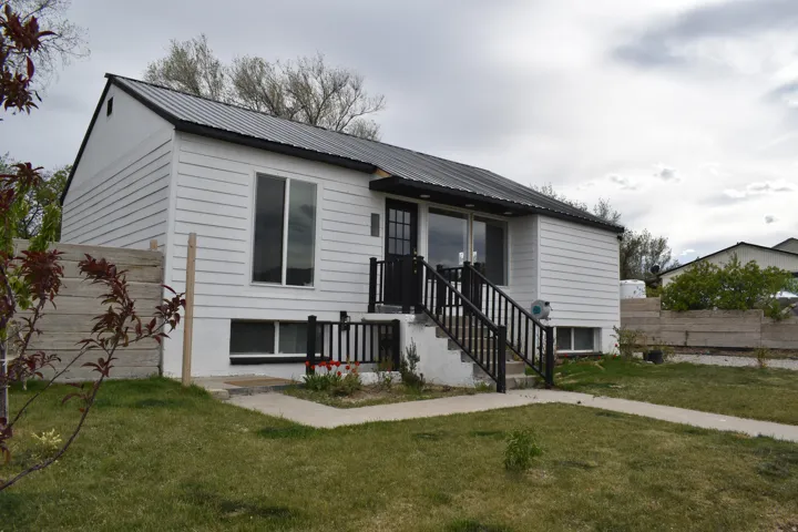 View of front of home featuring a metal roof