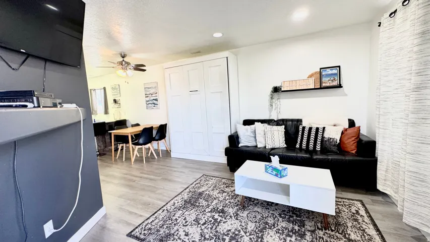 Living area featuring light wood-type flooring, recessed lighting, and ceiling fan