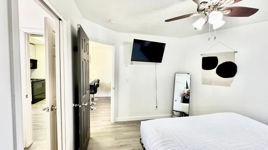 Bedroom with light wood-style flooring and ceiling fan