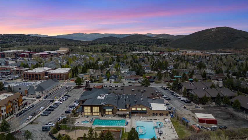 Drone / aerial view of mountains and a pool area