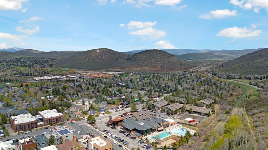 Aerial view of a mountainous background and a pool