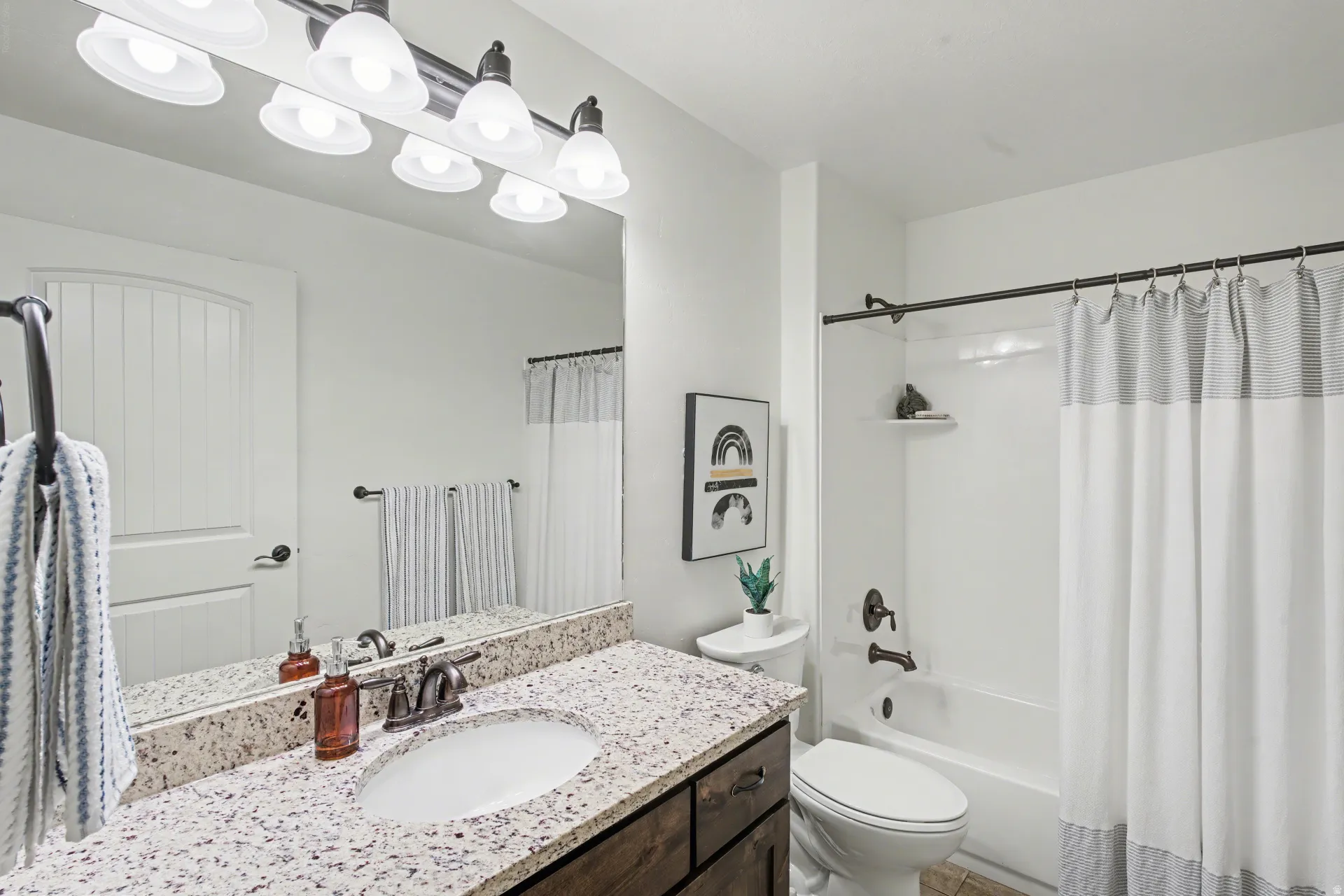 Bathroom featuring vanity and shower / bath combo