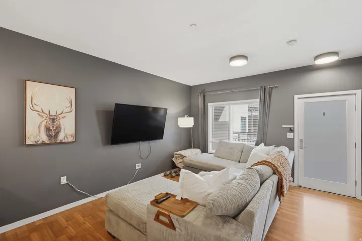 Living room with wood finished floors and baseboards