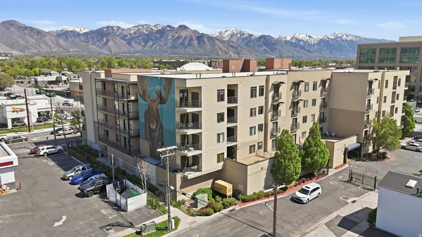 View of apartment building / complex featuring a mountain view