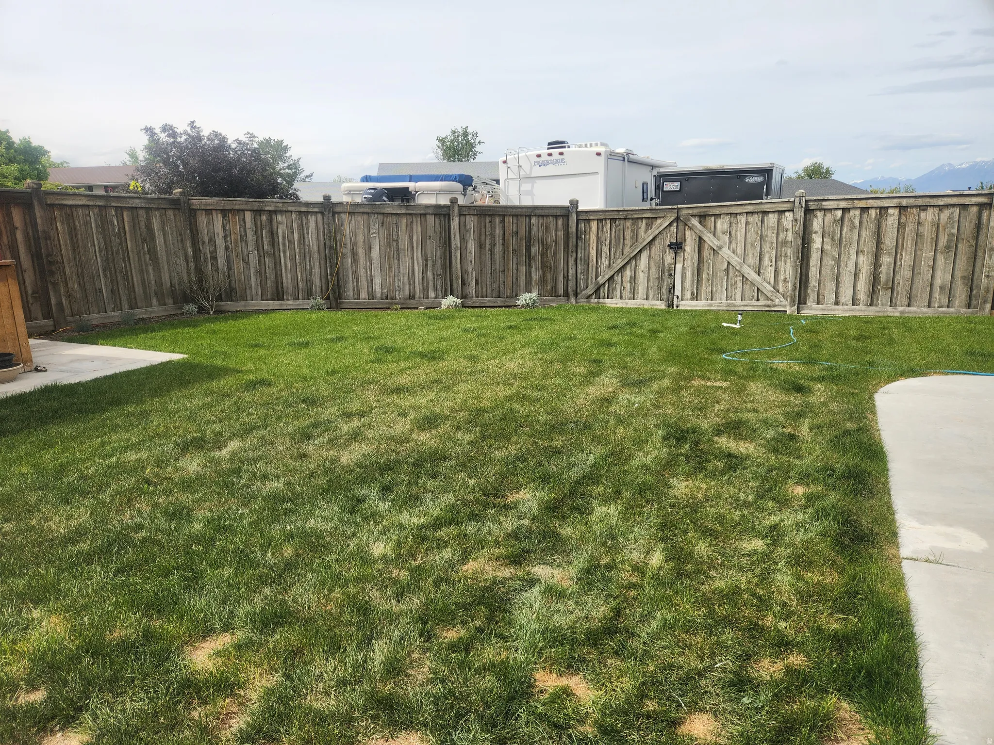 Fenced backyard with a gate